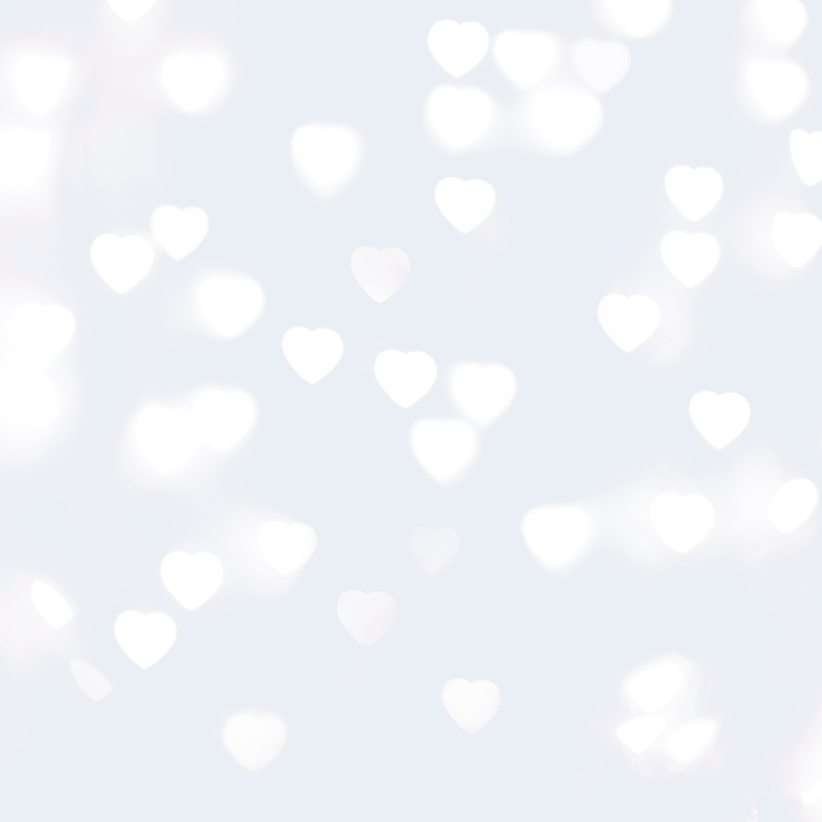 Blurred Unfocussed White Lights in the Shape of Heart White Background